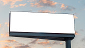 Mock up image - wide blank white billboard and clouds against sunset blue sky