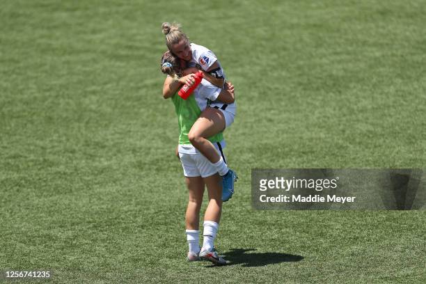 Christen Westphal and Autumn Smithers of Portland Thorns FC celebrate after defeating the North Carolina Courage in the quarterfinal match of the...