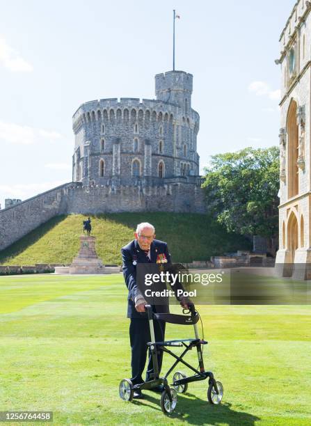 Captain Sir Thomas Moore poses after receiving his Knighthood from Queen Elizabeth II during an investiture ceremony at Windsor Castle on July 17,...
