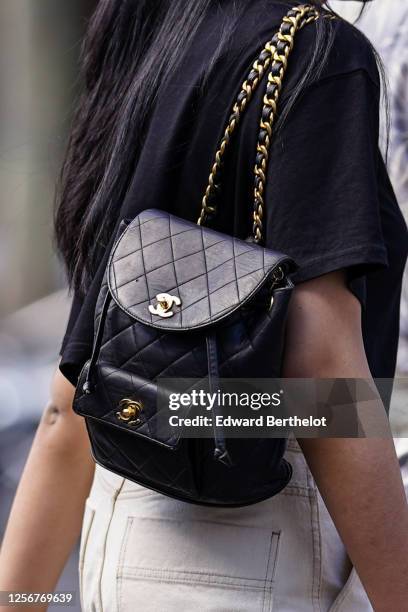 A passerby wears a black leather padded/ quilted Chanel backpack bag,... News Photo - Getty Images A passerby wears a black leather padded/ quilted Chanel backpack bag,... News Photo - Getty Images