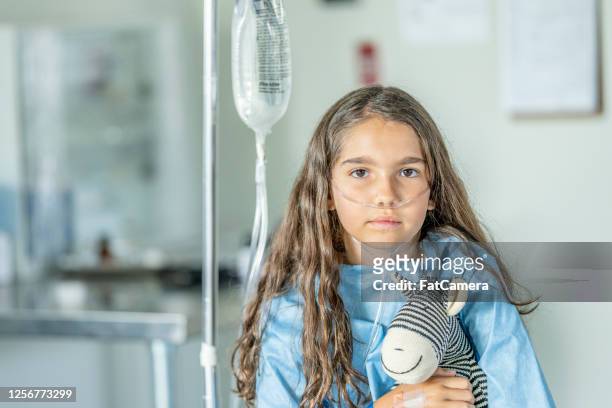 10 year old girl in hospital - nasal cannula stock pictures, royalty-free photos & images