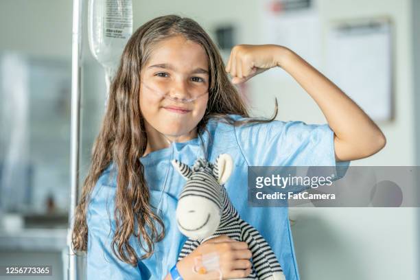 10 year old girl in hospital - childhood cancer stock pictures, royalty-free photos & images