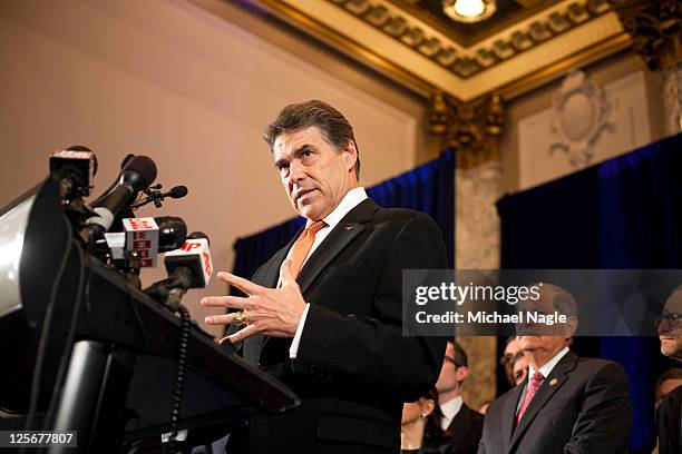 Texas Governor and Republican presidential hopeful Rick Perry speaks at a press conference with American and Israeli Jewish leaders and supporters of...