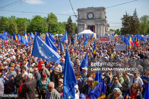 People take part in a pro-EU rally in Chisinau on May 21, 2023. Tens of thousands of Moldovans on May 21 urged for their country to get EU...