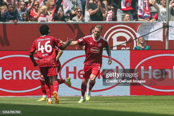 Andre Hoffmann of Fortuna Duesseldorf celebrates after scoring his team's first goal with teammates during the Second Bundesliga match between...