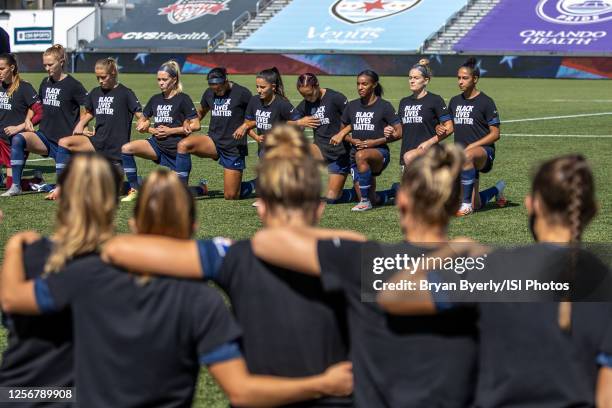 North Carolina Courage kneel for the national anthem during a game between Portland Thorns FC and North Carolina Courage at Zions Bank Stadium on...