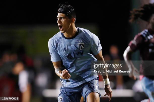 Alan Pulido of Sporting Kansas City celebrates after scoring a goal on a penalty kick in the 72nd minute against the Colorado Rapids during a Group D...