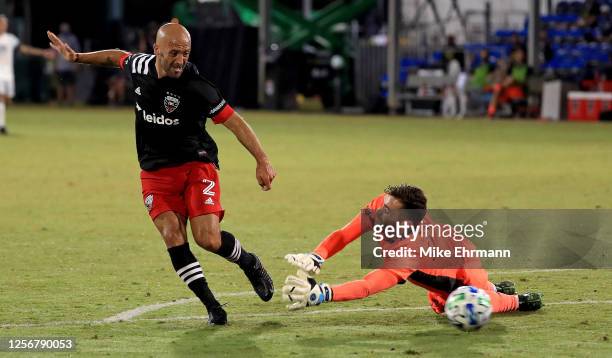 Federico Higuain D.C. United scores a goal on Matt Turner of New England Revolution during the group C match against the New England Revolution as a...