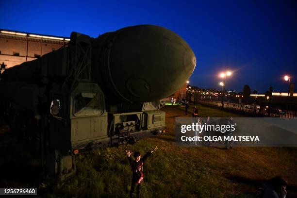 Visitors walk past a Russian Topol intercontinental ballistic missile in the Military Historical Museum of Artillery during the 'Night of Museums...