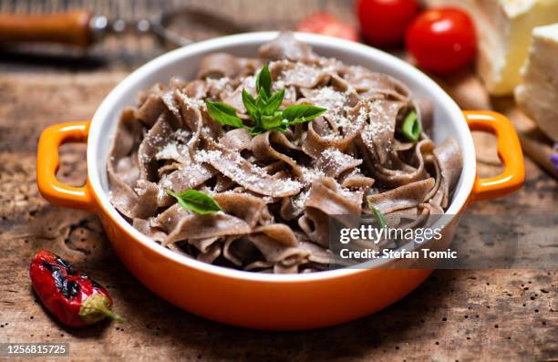 buckwheat pasta with parmesan and basil - whole wheat stock pictures, royalty-free photos & images