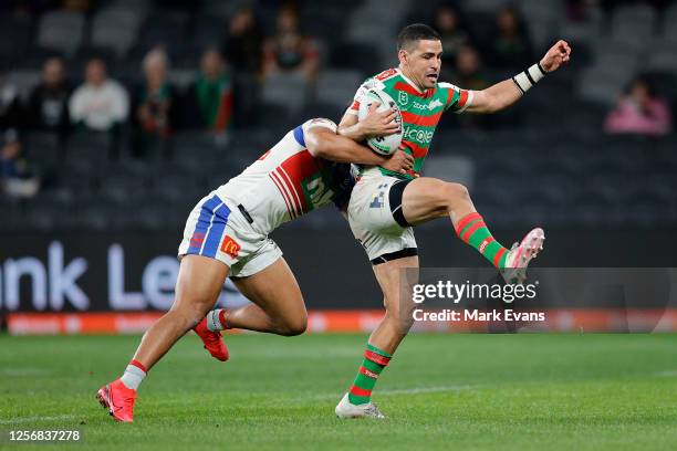 Cody Walker of Souths is tackled during the round 10 NRL match between the South Sydney Rabbitohs and the Newcastle Knights at Bankwest Stadium on...