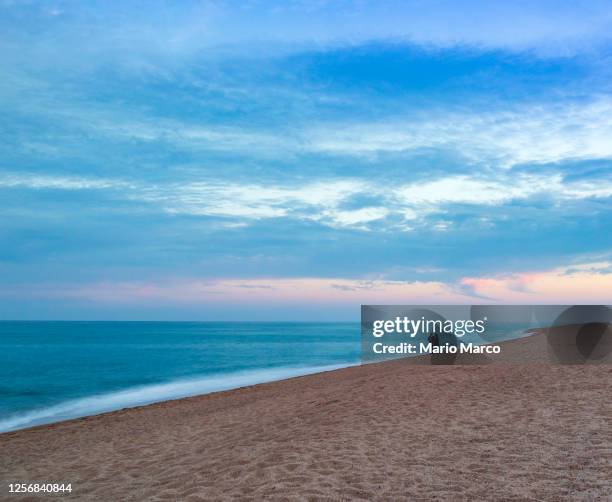 couple on the beach - maresme stock pictures, royalty-free photos & images