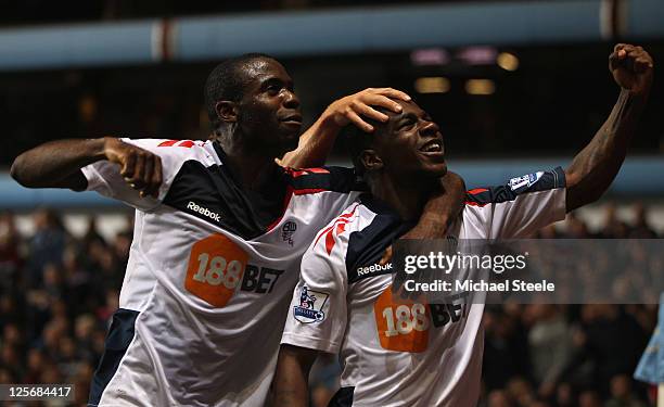 Gael Kakuta of Bolton Wanderers celebrates scoring his sides second goal with Fabrice Muamba during the Carling Cup third round match between Aston...