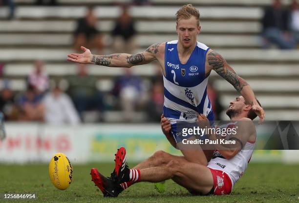 Kody Manning of the Sharks gets tackled by Zachary Dent of the Bulldogs during the round one WAFL match between the South Fremantle Bulldogs and East...