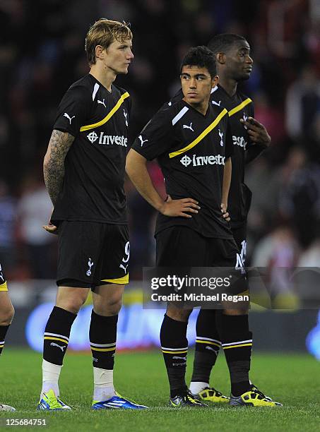 Roman Pavlyuchenko and Massiomo Luongo of Tottenham look dejected during penalty shoot-out to decide the Carling Cup Third Round match between Stoke...