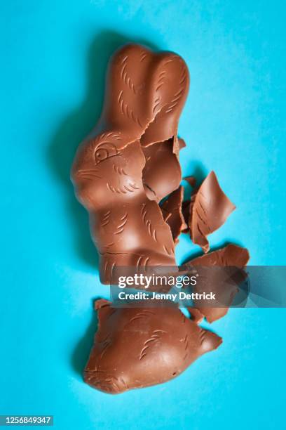 broken chocolate bunny - chocolate bunny stock pictures, royalty-free photos & images