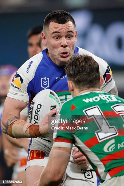 David Klemmer of the Knights runs into Cameron Murray of Souths during the round 10 NRL match between the South Sydney Rabbitohs and the Newcastle...