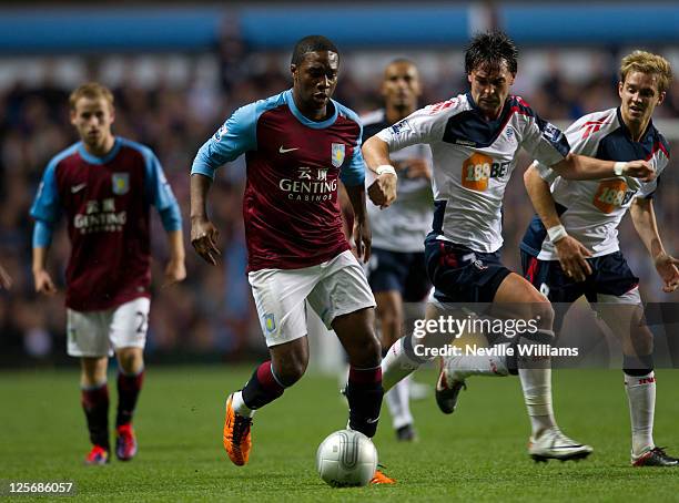 Charles N'Zogbia of Aston Villa challenged by Chris Eagles of Bolton Wanderers during the Carling Cup third round match between Aston Villa and...