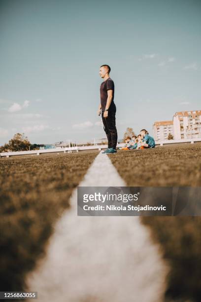 confident soccer coach posing for photography - referee card stock pictures, royalty-free photos & images