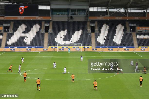 General view inside the stadium as Players takes a knee in support of the Black Lives Matter movement prior to during the Sky Bet Championship match...