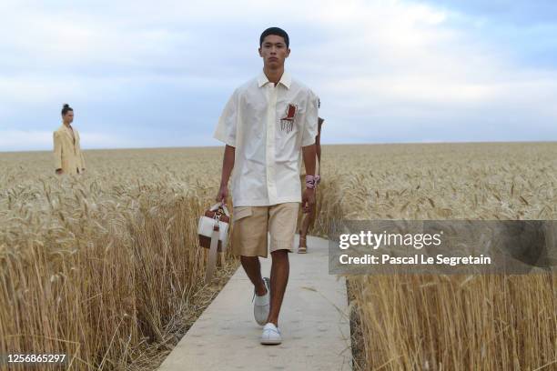 Models walk on the runway during "L'Amour" : Jacquemus Spring-Summer 2021 Show on July 16, 2020 in Paris, France.