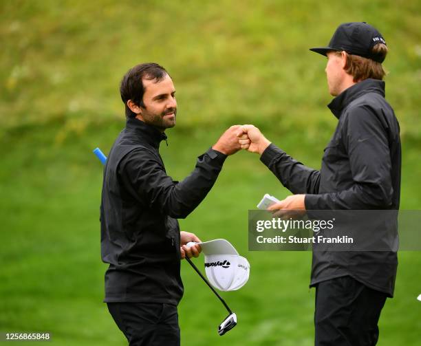 Joel Stalter of France is congratulated by Alexander Knappe of Germany on the 18th green during day four of the Euram Bank Open at Golf Club Adamstal...