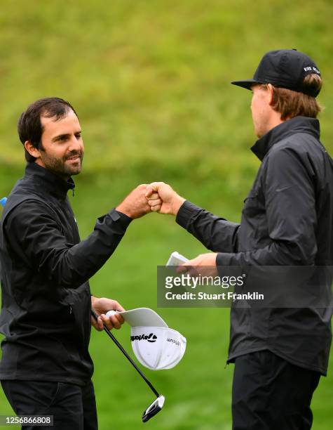 Joel Stalter of France is congratulated by Alexander Knappe of Germany on the 18th green during day four of the Euram Bank Open at Golf Club Adamstal...