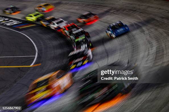 Nascar Glow Racers Cars race with under glow lighting during the NASCAR Cup Series... News ...