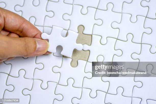 One Puzzle 1 Puzzle Pieces Photos and Premium High Res Pictures - Getty Images