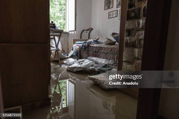 Volunteers help residents to clear streets and houses by shoveling mud in neighborhoods that have been submerged by water and mud in Forli, Emilia...