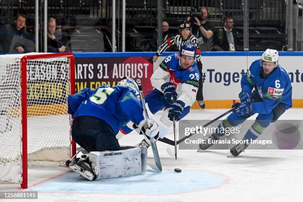 Richard Panik of Slovakia tries to score against goalkeeper Luka Gracnar of Slovenia during the 2023 IIHF Ice Hockey World Championship Finland -...