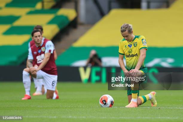 Todd Cantwell of Norwich City takes a knee in support of the Black Lives Matter movement prior to the Premier League match between Norwich City and...