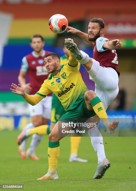 Erik Pieters of Burnley and Emiliano Buendia of Norwich City battle for the ball during the Premier League match between Norwich City and Burnley FC...