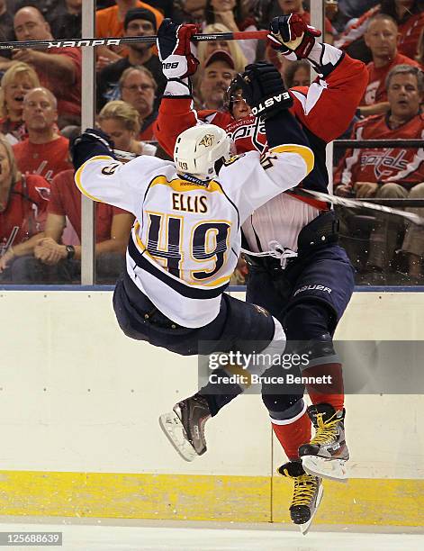 Ryan Ellis of the Nashville Predators collides with Alex Ovechkin of the Washington Capitals at the 1st Mariner Arena on September 20, 2011 in...