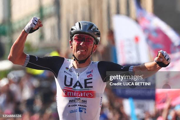 Team Emirates's US rider Brandon McNulty celebrates as he crosses the finish line to win the fifteenth stage of the Giro d'Italia 2023 cycling race,...