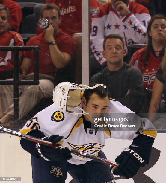 Taylor Beck of the Nashville Predators has his helmet knocked off by a puck in his game against the Washington Capitals at the 1st Mariner Arena on...