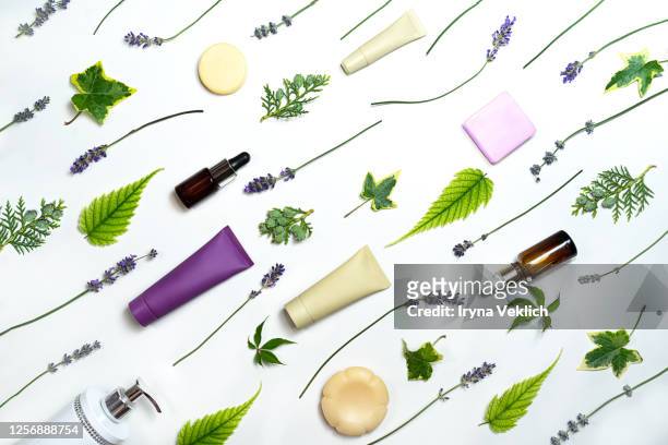 lavender flowers and beauty cosmetics products isolated on white background. - cosmetic bottle stock-fotos und bilder