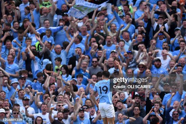 Manchester City's Argentinian striker Julian Alvarez celebrates scoring the opening goal during the English Premier League football match between...