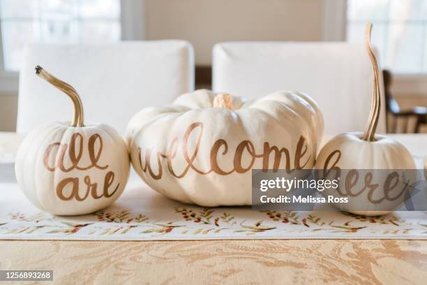 white pumpkins table centerpiece - pumpkin decorating stock pictures, royalty-free photos & images