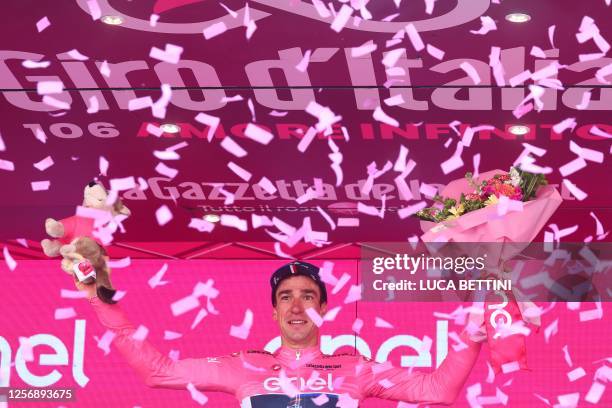 Groupama - FDJ's French rider Bruno Armirail celebrates his overall leader's pink jersey on the podium after the fifteenth stage of the Giro d'Italia...