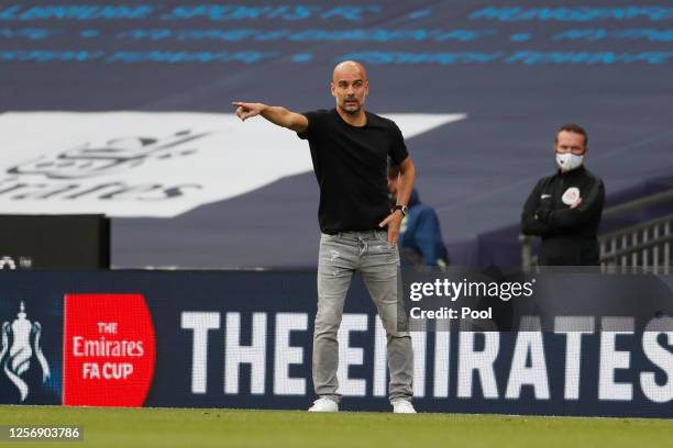 Pep Guardiola, Manager of Manchester City gives his team instructions during the FA Cup Semi Final match between Arsenal and Manchester City at...