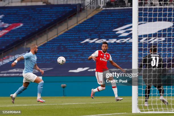 Pierre-Emerick Aubameyang of Arsenal scores his team's first goal during the FA Cup Semi Final match between Arsenal and Manchester City at Wembley...