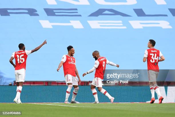 Pierre-Emerick Aubameyang of Arsenal celebrates with teammates after scoring his team's first goal during the FA Cup Semi Final match between Arsenal...
