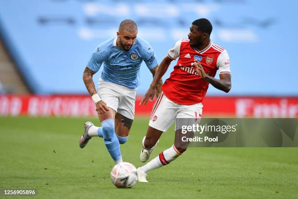 Kyle Walker of Manchester City and Ainsley Maitland-Niles of Arsenal battle for the ball during the FA Cup Semi Final match between Arsenal and...