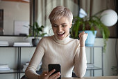 Employee holding smartphone use e-bank app check balance feels happy