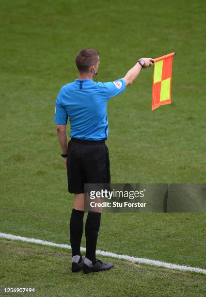 An assistant referee flags for offside during the Sky Bet Championship match between Swansea City and Bristol City at Liberty Stadium on July 18,...