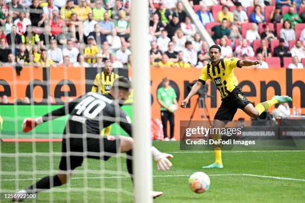 Sebastien Haller of Borussia Dortmund scores his team's first goal during the Bundesliga match between FC Augsburg and Borussia Dortmund at WWK-Arena...