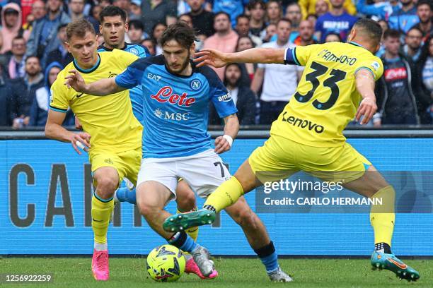 Napoli's Georgian forward Khvicha Kvaratskhelia challenges Inter Milan's Italian midfielder Nicolo Barella and Inter Milan's Italian defender Danilo...