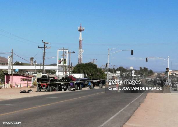 Members of the army and police secure the perimeter at the site of a long-gun attack on a group of amateur rally drivers in Ensenada, Mexico, on May...