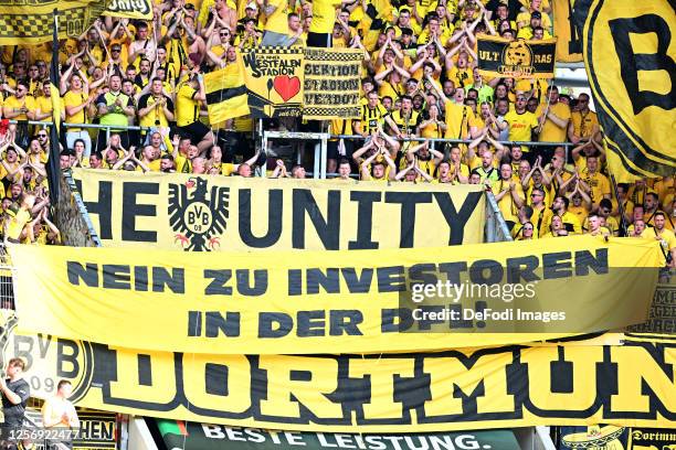 Suppotzrt with banner during the Bundesliga match between FC Augsburg and Borussia Dortmund at WWK-Arena on May 21, 2023 in Augsburg, Germany.